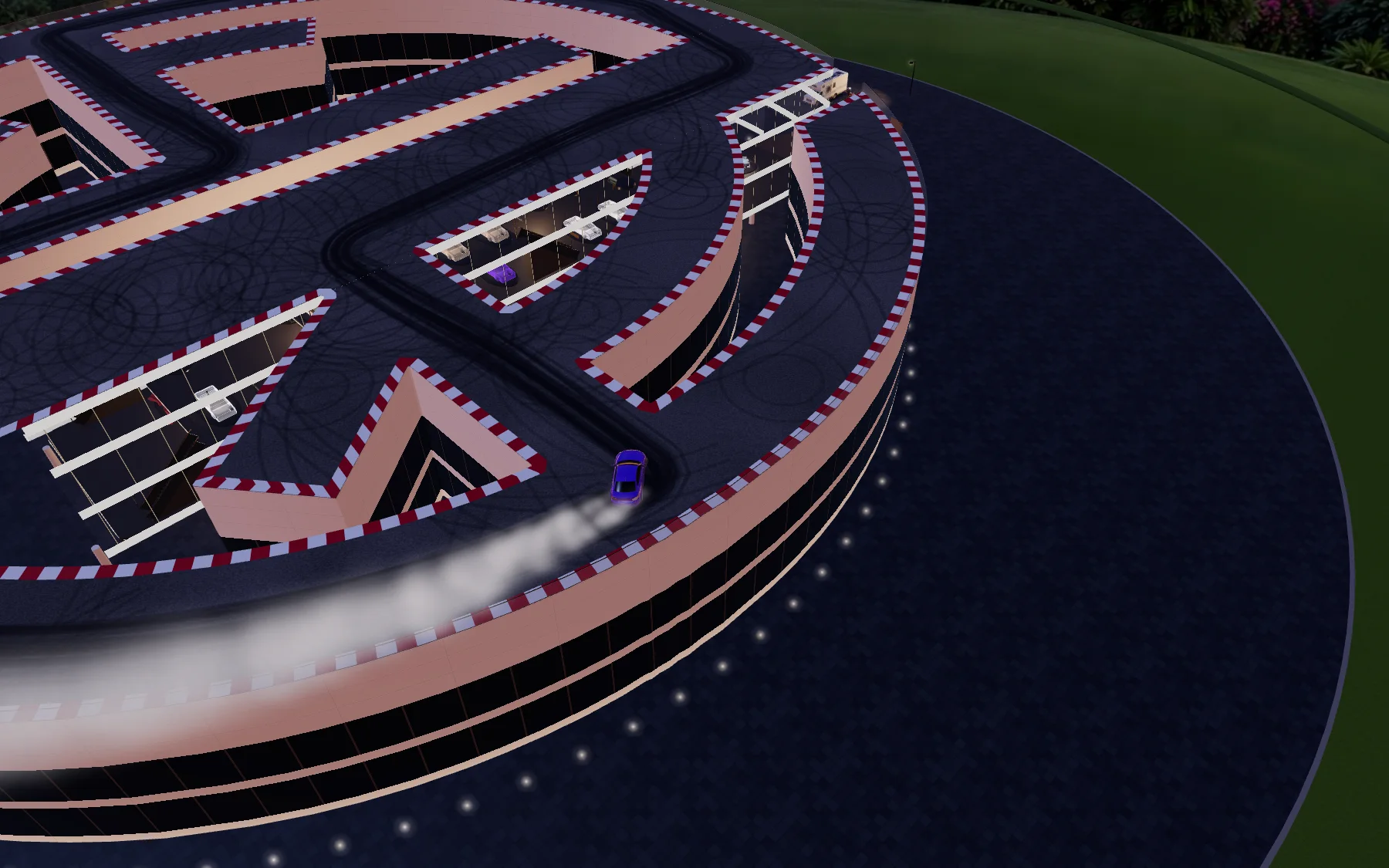 High drone view: a ring-shaped building drawn as the YR monogram, its whole roof a drift track with a purple M2 trailing smoke.